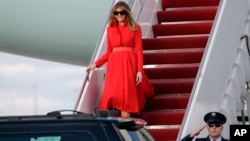First lady Melania Trump walks from Air Force One after arriving with President Donald Trump and their son, Barron, at the Palm Beach International Airport, March 17, 2017, in West Palm Beach, Florida. 