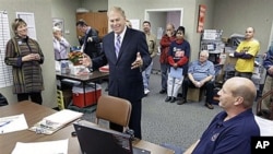 Ohio Gov. Ted Strickland, center, talks with union supporters of his re-election campaign at the Building Laborers' Hall in Cleveland, 19 Oct 2010