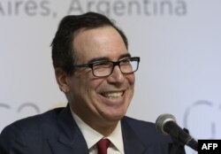 U.S. Treasury Secretary Steven Mnuchin delivers a speech during the G-20 meeting of finance ministers and central bank governors, in Buenos Aires, March 20, 2018. Mnuchin said the United States is not seeking a trade war over tariffs but does not fear one.