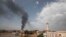 FILE - Smoke rises over Khartoum, Sudan, Thursday, June 8, 2023, as fighting between the Sudanese army and paramilitary Rapid Support Forces continues. 