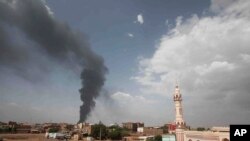 FILE - Smoke rises over Khartoum, Sudan, Thursday, June 8, 2023, as fighting between the Sudanese army and paramilitary Rapid Support Forces continues.