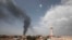 FILE - Smoke rises over Khartoum, Sudan, Thursday, June 8, 2023, as fighting between the Sudanese army and paramilitary Rapid Support Forces continues.