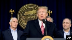 President Donald Trump, accompanied by Vice President Mike Pence, left, and House Republican Majority Whip Steve Scalise, right, speaks to members of the media after participating in a Congressional Republican Leadership Retreat at Camp David, Mary