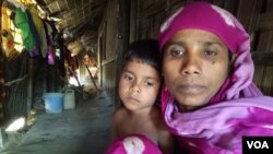 FILE - Rohingya refugee woman Noor Ayesha and her 5-year-old daughter at a Rohingya colony in Cox's Bazar, Bangladesh. 