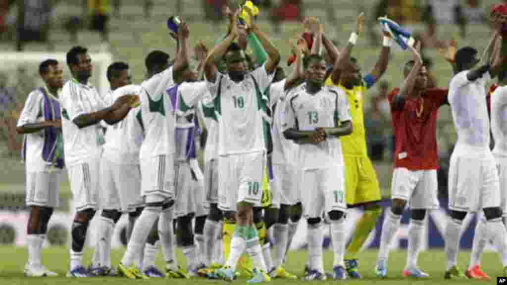 Nigeria's John Obi Mikel, left, and his teammates wave to spectators.
