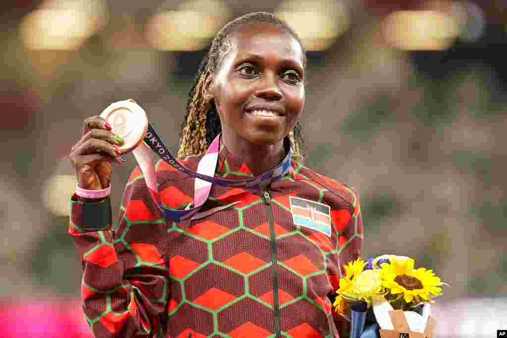 Bronze medalist Hyvin Kiyeng, of Kenya, poses during the medal ceremony for the women's 3,000-meter steeplechase at the 2020 Summer Olympics, Wednesday, Aug. 4, 2021, in Tokyo. (AP Photo/Martin Meissner)
