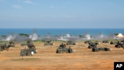 Taiwan's military fire artillery from M110A2 self-propelled Howitzers during the annual Han Kuang exercises in Hsinchu, north eastern Taiwan, Thursday, Sept. 10, 2015.
