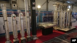 FILE: Iran's domestically built centrifuges are displayed in an exhibition of the country's nuclear achievements, in Tehran, Iran, Wednesday, Feb. 8, 2023. The head of the United Nations nuclear watchdog on Tuesday stressed the urgency of efforts to limit Iran's nuclear program.