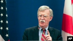 FILE - U.S. National Security Adviser John Bolton gestures while speaking to the media in Tbilisi, Georgia, Oct. 26, 2018. 