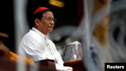 FILE - Cardinal Charles Bo, Archbishop of Yangon, attends the ceremony of interfaith praying in Yangon, Myanmar, Oct. 10, 2017 .