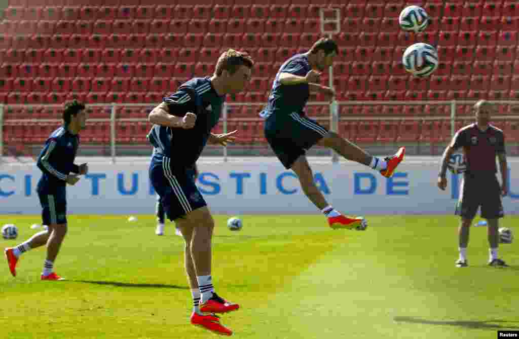 Russia's national soccer team players train at the municipal stadium in the town of Itu north-west of Sao Paulo, Brazil, June 20, 2014. 