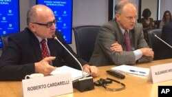 Roberto Cardarelli, mission chief for Argentina, left, and Alejandro Werner, director of the International Monetary Fund’s Western Hemisphere Department, hold a press conference at the IMF headquarters in Washington, June 8, 2018.