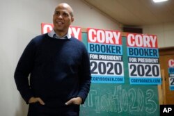 U.S. Sen. Cory Booker, D-N.J., waits as he is introduced to speak at a meet and greet with local residents at the First Congregational United Church of Christ, Feb. 8, 2019, in Mason City, Iowa.