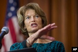 FILE - Sen. Lisa Murkowski, R-Alaska, speaks after an order withdrawing federal protections for countless waterways and wetland was signed, at EPA headquarters in Washington, Dec. 11, 2018.