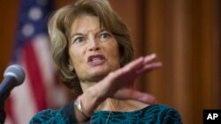 Sen. Lisa Murkowski, R-Alaska, speaks after an order withdrawing federal protections for countless waterways and wetland was signed, at EPA headquarters in Washington, Dec. 11, 2018. 