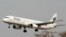 FILE - A Pakistan International Airlines (PIA) plane prepares to land at Islamabad airport in Islamabad, February 24, 2007.