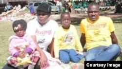 Sheffra Dzamara and her children with a member of Occupy Africa Unity Square in Harare. (Photo: Charles Nyoni)