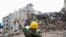 A rescue worker attempts to find survivors from the rubble of the collapsed Rana Plaza building in Savar, 30 km (19 miles) outside Dhaka, April 30, 2013. 