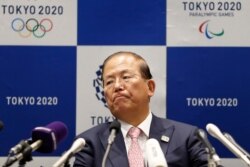 FILE - Tokyo 2020 Organizing Committee CEO Toshiro Muto attends a news conference after a Tokyo 2020 executive board meeting in Tokyo, March 30, 2020.