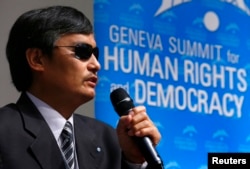 FILE - Blind Chinese dissident Chen Guangcheng addresses the sixth Geneva Summit for Human Rights and Democracy after receiving its first Courage Award, in Geneva, Feb. 25, 2014.