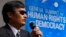 Blind Chinese dissident Chen Guangcheng addresses the sixth Geneva Summit for Human Rights and Democracy after receiving its first Courage Award, in Geneva, Feb. 25, 2014.
