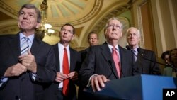 Senate Republican leaders, from left, Sen. Roy Blunt, R-Mo., Sen. John Barrasso, R-Wyo., Sen. John Thune, R-S.D., Senate Minority Leader Mitch McConnell, R-Ky., and Senate Minority Whip John Cornyn, R-Texas, meet with reporters, at the Capitol in Washington, July 29, 2014.