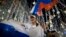 Russian soccer fans celebrate the national team victory after the group A match between Russia and Egypt during the 2018 soccer World Cup in Moscow, Russia, early on June 20, 2018.