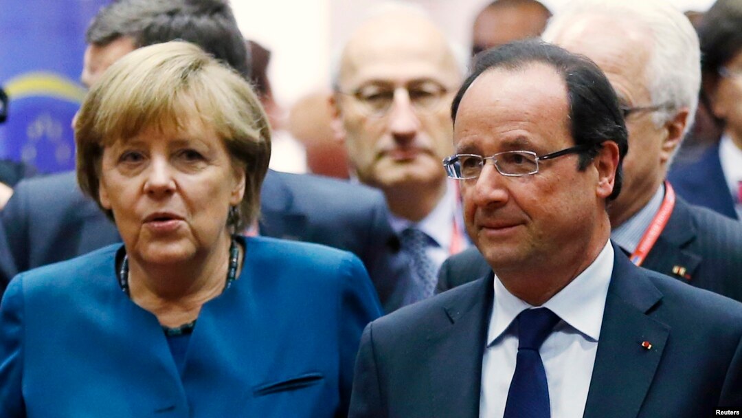 Kanselir Jerman Angela Merkel dan Presiden Perancis Francois Hollande (kanan) menghadiri KTT Energi Uni Eropa di Brussels (22/5). 