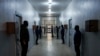 Guards stand in a corridor Syrian Democratic Forces-run Gweiran Prison, now called Panorama, which houses men accused of being Islamic State fighters in Hassakeh, northeastern Syria, Jan. 31, 2025. 