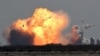 The SpaceX Starship SN9 explodes into a fireball after its high altitude test flight from test facilities in Boca Chica, Texas, Feb. 2, 2021. 