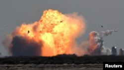 The SpaceX Starship SN9 explodes into a fireball after its high altitude test flight from test facilities in Boca Chica, Texas, Feb. 2, 2021. 