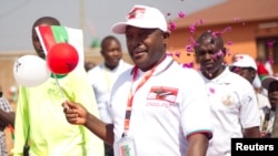 FILE - Burundi's President Pierre Nkurunziza arrives for a CNDD-FDD party congress in Gitega province, Burundi, Aug. 20, 2016. It was his decision to seek a third term that sparked violence in the nation last year.