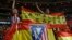 Atletico Madrid supporters hold up a Spanish flag reading: "Catalonia is Spain" during a Spanish La Liga soccer match between Atletico Madrid and Barcelona at the Metropolitano stadium in Madrid, Spain, Oct. 14, 2017. 