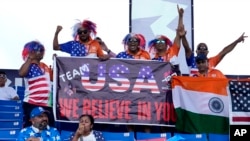 Fans of the United States cricket team cheer before an ICC Men's T20 World Cup cricket match between the United States and Ireland at the Central Broward Regional Park Stadium in Lauderhill, Fla., June 14, 2024. The match was abandoned due to rain. 