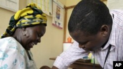A baby receives an injection in a malaria vaccine trial in the Kenya coastal town of Kilifi.