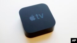 The Apple TV is displayed, in New York on Sept. 15, 2017. The new Apple TV streaming device heralds the onset of ultra high-definition 4K video for the mass audience.