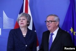European Commission President Jean-Claude Juncker meets with British Prime Minister Theresa May at the European Commission headquarters in Brussels, Belgium, Feb. 7, 2019.