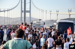 People against the attempted coup gather on Istanbul's Bosphorus Bridge, July 16, 2016. Coup plotters had briefly closed the bridge and another span over the Bosphorus Strait in their attempted takeover.