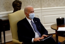 U.S. President Joe Biden meets with Democratic senators to discuss efforts to pass coronavirus relief legislation, in the Oval Office, Feb. 3, 2021.