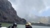 Members of a dive squad conduct a search during a recovery operation around White Island, a volcanic island that erupted earlier this week, in New Zealand, Dec. 13, 2019, in this police handout photo.