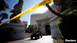 A member of the FBI leaves the Mandalay Bay Resort and Casino, from which Stephen Paddock shot and killed 58 people and wounded hundreds more on Oct. 1, in Las Vegas, Nevada, Oct. 4, 2017.