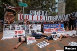 Protesters against Philippine President Rodrigo Duterte demonstrate near the hotel where he is staying at during his visit to Hong Kong, April 12, 2018.