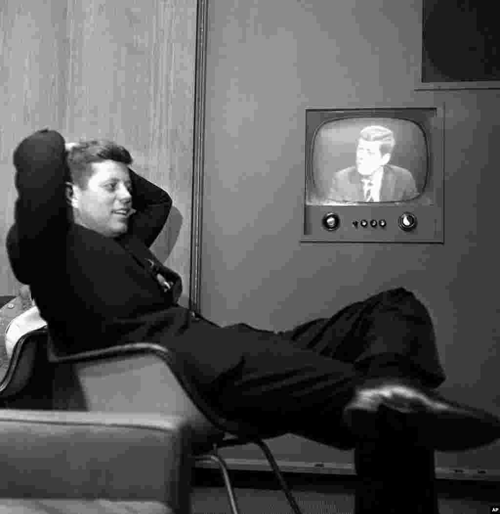 Sen. John F. Kennedy, Democratic presidential nominee, sees a playback of his televised appearance in Milwaukee, Wis., April 3, 1960. Sen. Kennedy answered questions and gave his views as part of his campaign to win the Wisconsin presidential preference 