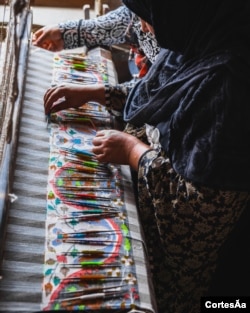 An artisan weaves Pashmina fabric in Srinagar. (Me&K photo)