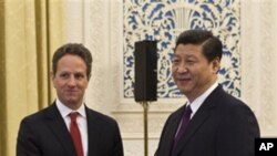 中國副主席習近平(右)1月11日在北京會見到訪的美國財政部長蓋特納