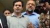 Awais Shah, center left, speaks to journalists with his father Sajjad Ali Shah, center right, chief justice of Sindh's High Court, after the son was rescued from kidnappers, in Karachi, Pakistan, Tuesday, July 19, 2016.