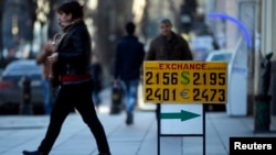 A currency exchange rate is displayed on the street in Tbilisi, Feb. 23, 2015. 