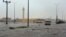FILE - In this Nov. 24, 2015 image released by the Saudi Press Agency, SPA, a car drives on a flooded street in Al-Qassim Region, west of Riyadh, Saudi Arabia.