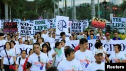 Participants join a procession against plans to reimpose death penalty, promote contraceptives and intensify drug war during "Walk for Life" in Manila, Philippines, Feb. 18, 2017.