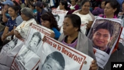 Relatives and friends of the 43 missing missing of Ayotzinapa, wait before experts of the Inter-American Commission on Human Rights (IACHR) designated to investigate the disappearance present the first conclusions of their investigation, in Mexico City, S